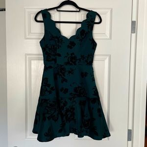 Green and black velvet scuba dress with scalloped neckline